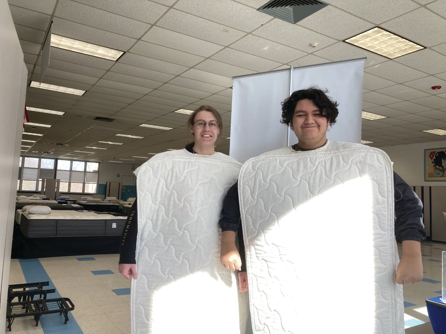MIGHTY MUSICIANS: JHS percussionist Johnathan Guilmette and Trumpet player Gerson Cabrera show off their mattress outfits to promote Saturday’s sale that helped fund the music department’s trip to Williamsburg, Virginia. The students left at 5 a.m. Thursday morning.